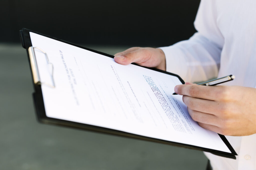 close-up-man-signing-contract