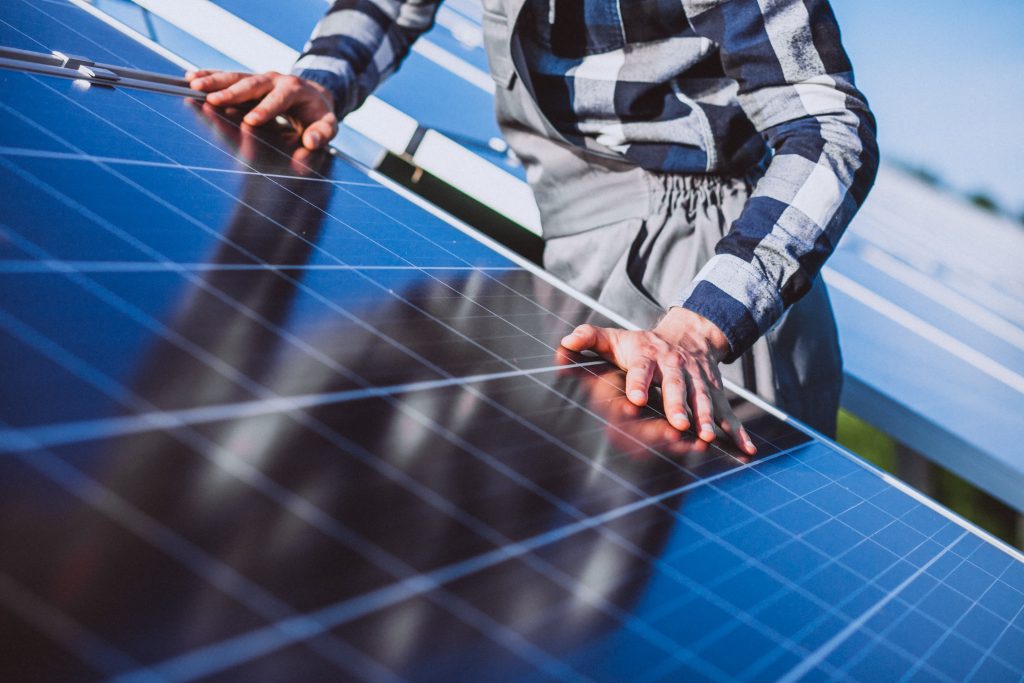 man-worker-firld-by-solar-panels-2
